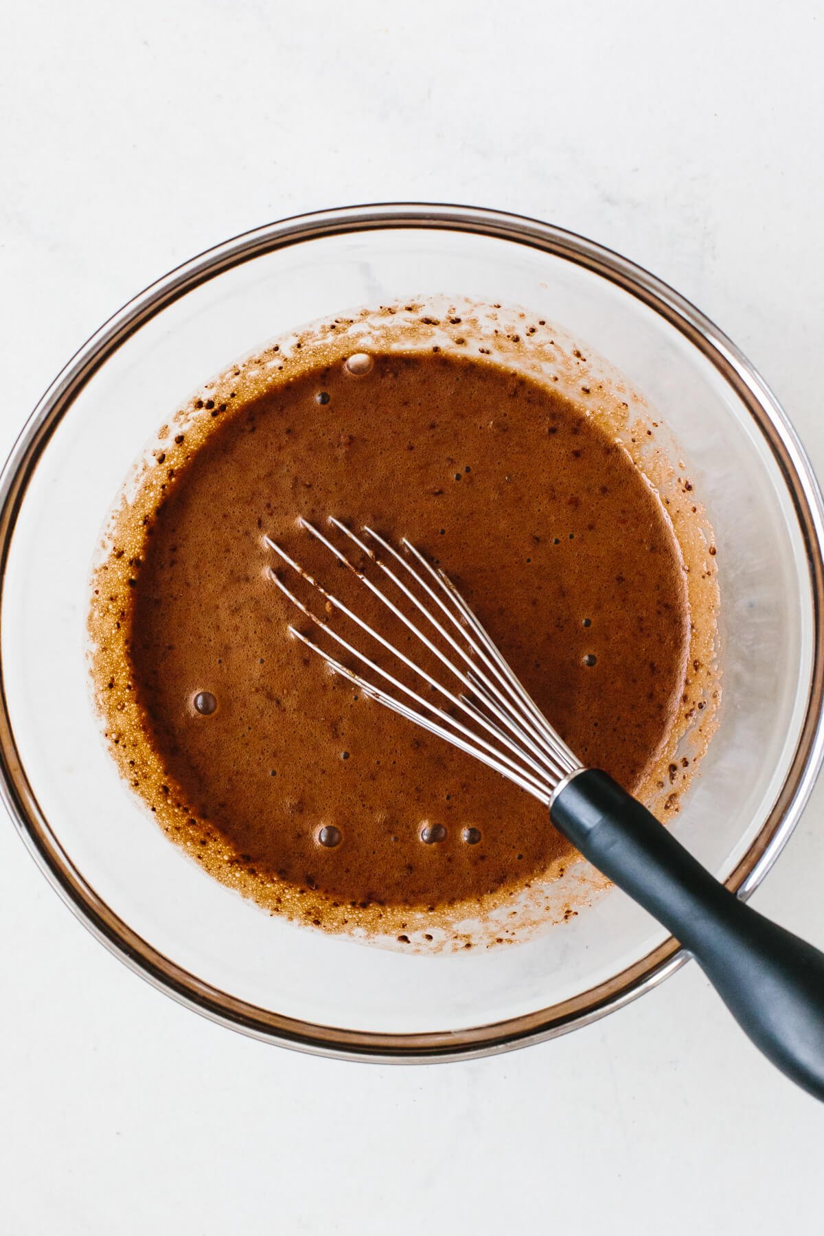 Mixing chocolate chia pudding in a bowl