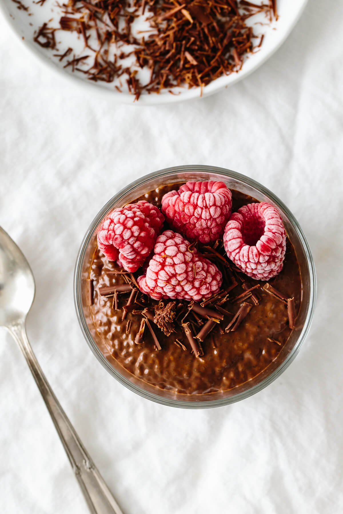 A glass bowl of chocolate chia pudding