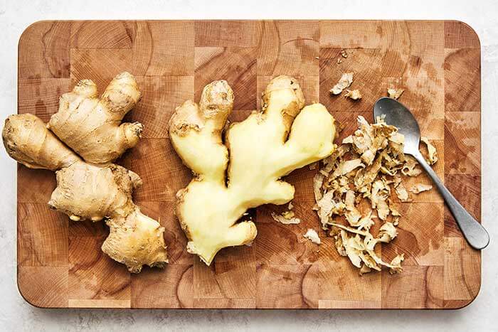 Peeling ginger with a spoon