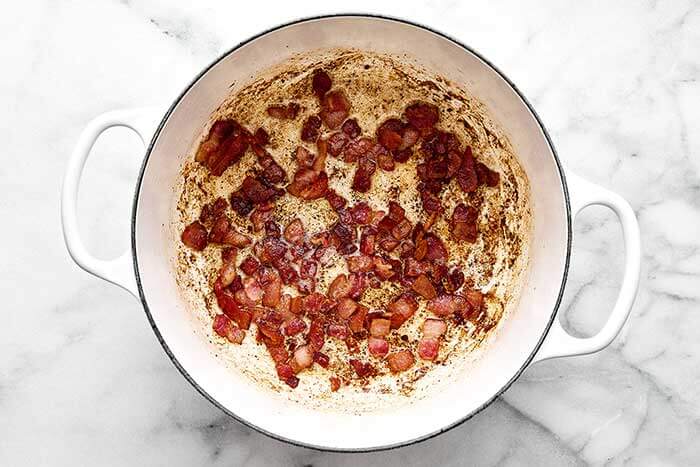 Cooking bacon in a pot.