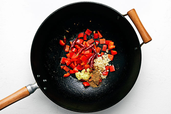 Cooking spices in a wok