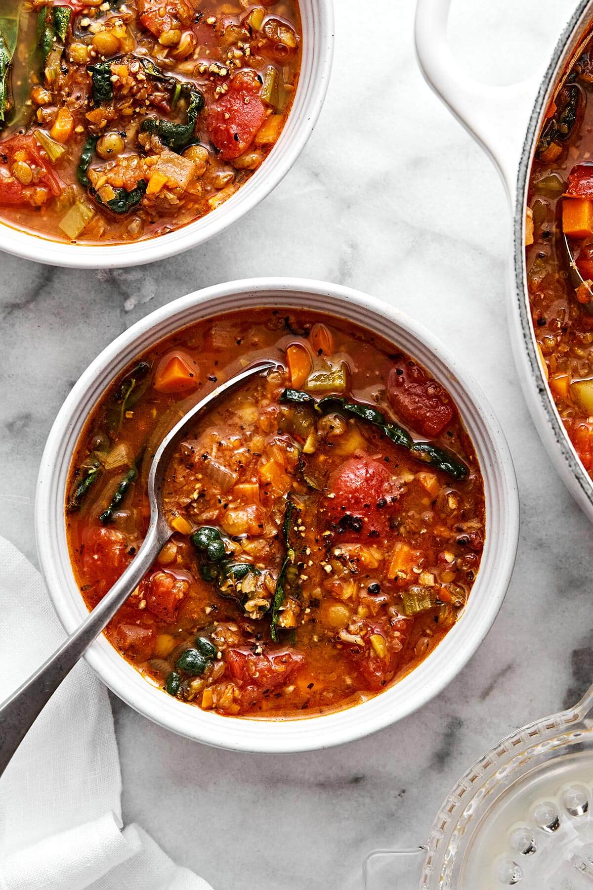 Lentil soup is the perfect vegetarian meal to cozy up with for fall and winter. It’s hearty, healthy, and wonderfully filling thanks to its plant-based protein. And while there are many variations of lentil soup, this simple and vibrant Mediterranean version is extra special. Bowls of Mediterranean lentil soup.