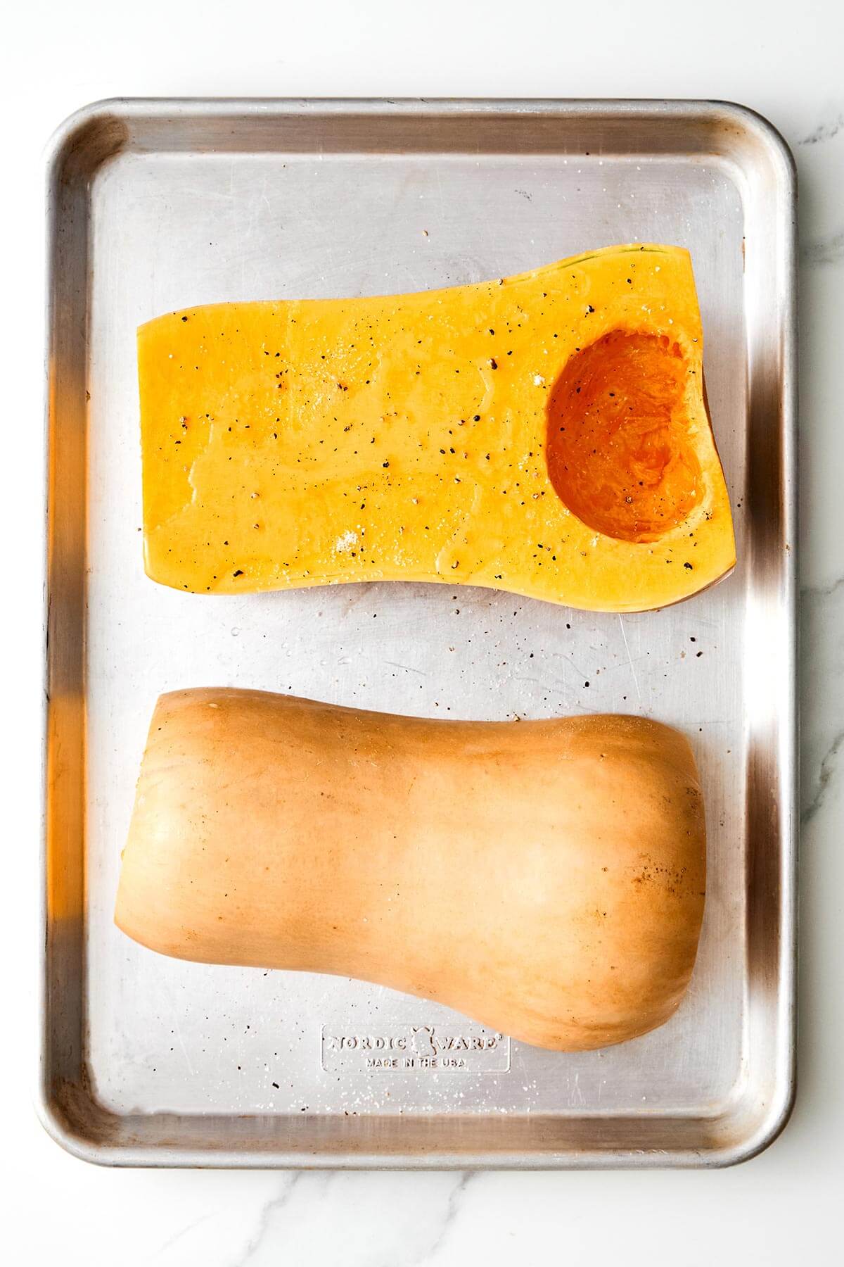 Seasoning butternut squash.