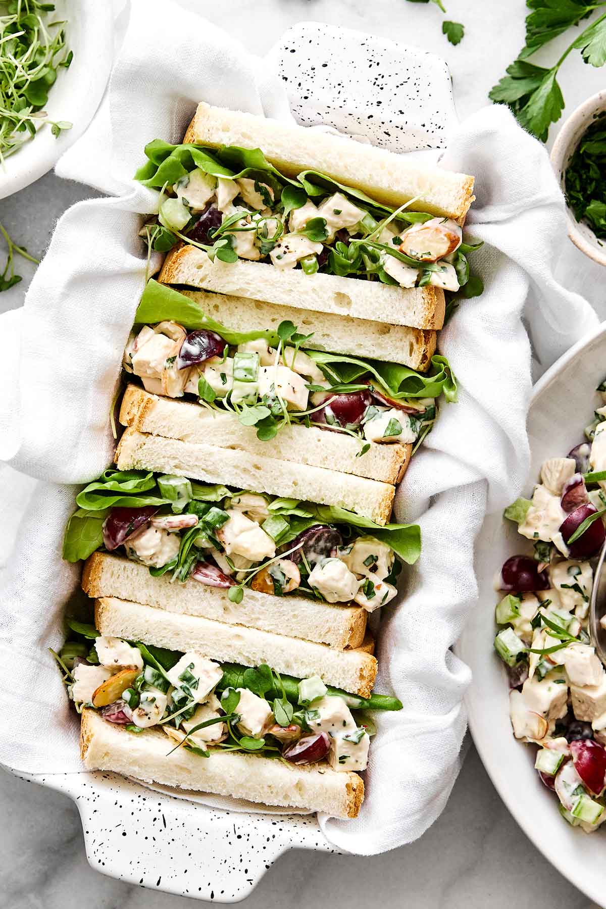 This is everyone's favorite chicken salad! It's layered with fresh flavors, delicious textures, and is sure to be a potluck winner. Chicken salad sandwich.
