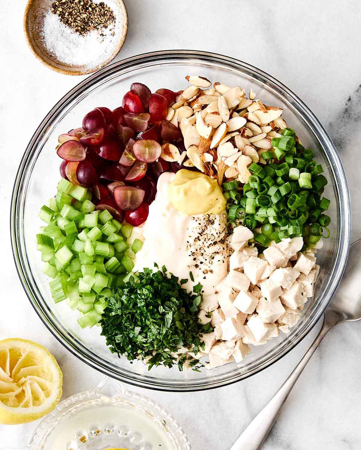 This is everyone's favorite chicken salad! It's layered with fresh flavors, delicious textures, and is sure to be a potluck winner. Step four of chicken salad: toss together.