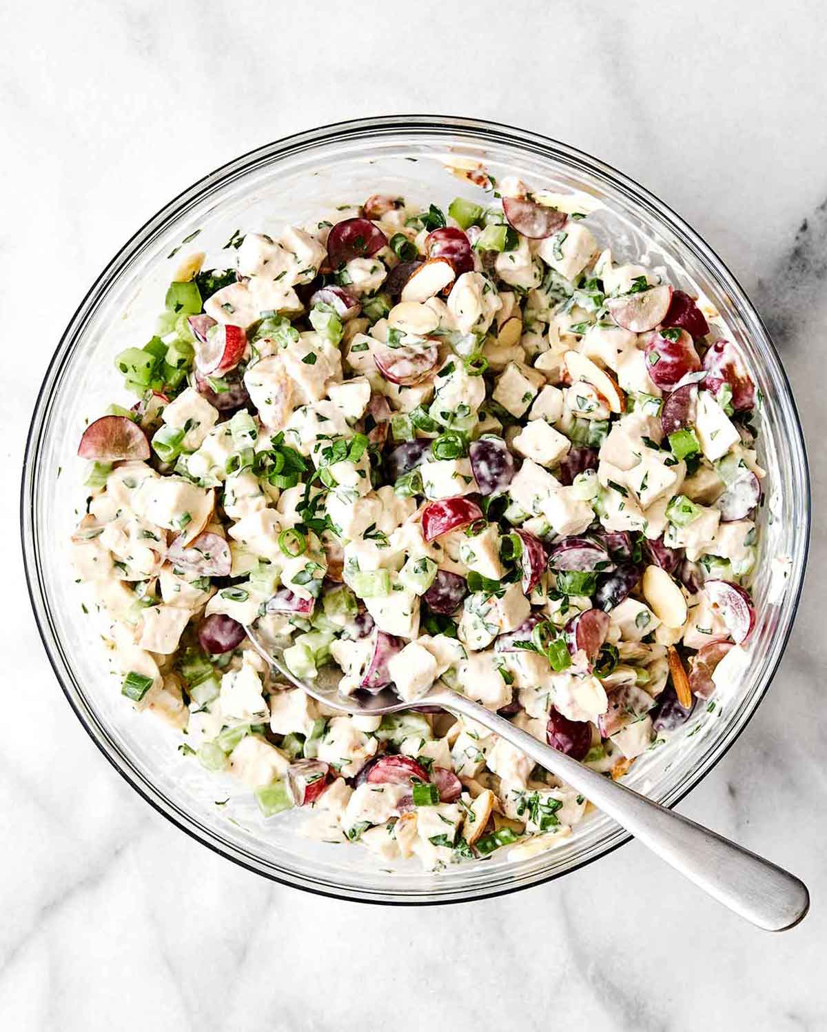 This is everyone's favorite chicken salad! It's layered with fresh flavors, delicious textures, and is sure to be a potluck winner. Step five of chicken salad: let it chill