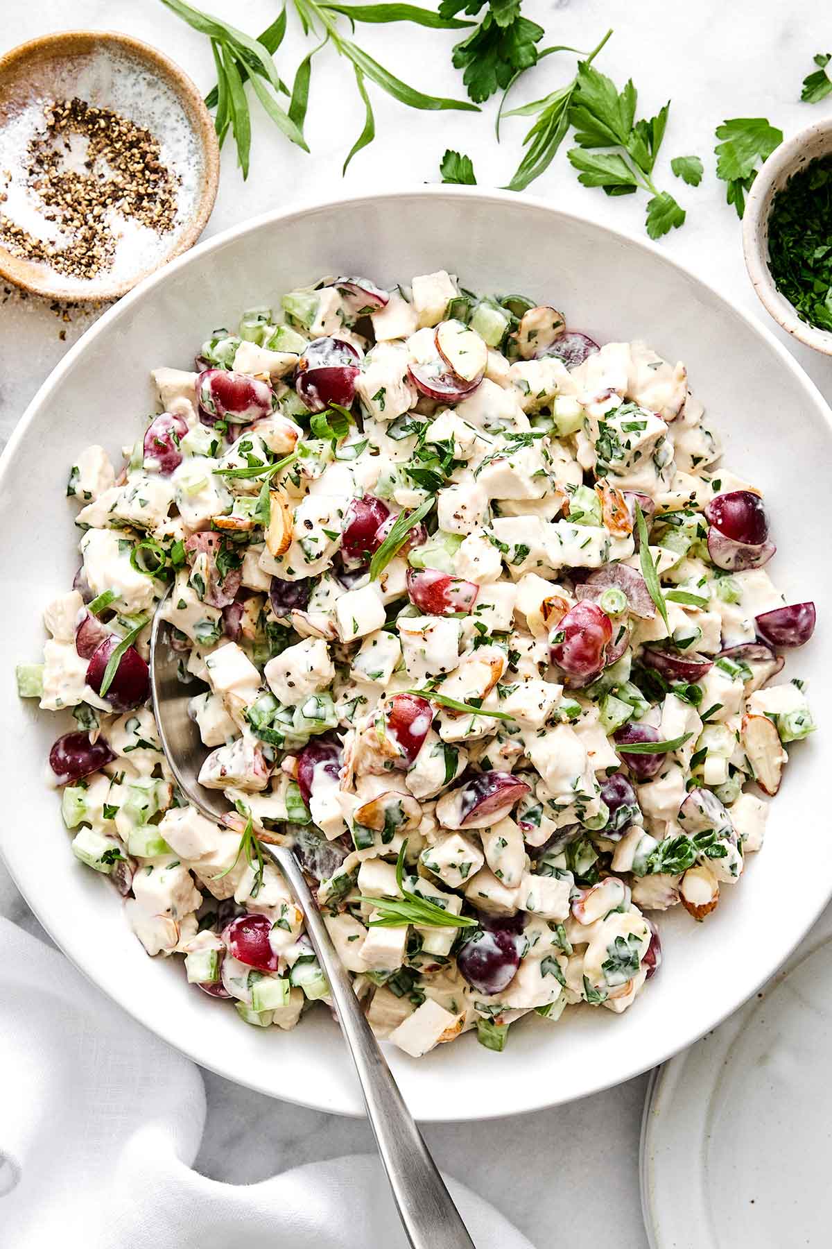 This is everyone's favorite chicken salad! It's layered with fresh flavors, delicious textures, and is sure to be a potluck winner. Chicken salad.