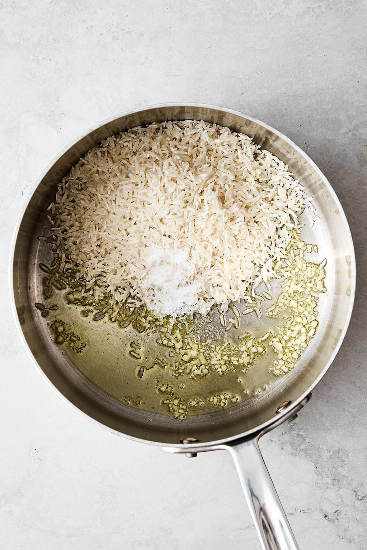 This cilantro lime rice is the best Chipotle copycat! It's bright, and zesty, and is the perfect side dish paired with Mexican mains. Cooking rice in a pot.