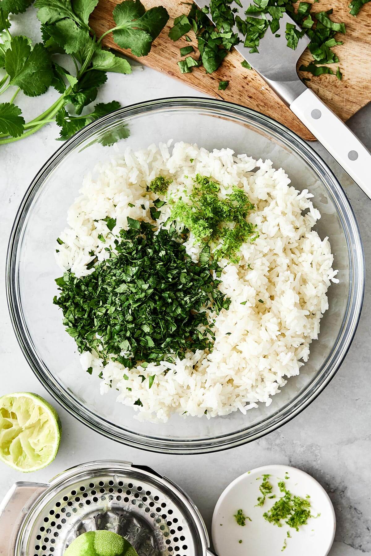 This cilantro lime rice is the best Chipotle copycat! It's bright, and zesty, and is the perfect side dish paired with Mexican mains. A bowl of cilantro lime rice ingredients.