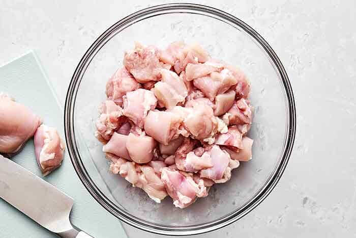 Prepping diced chicken for butter chicken.