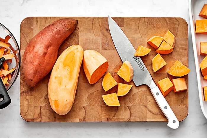 Sliced yams on a wooden board.