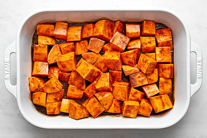 A dish of candied yams before baking.