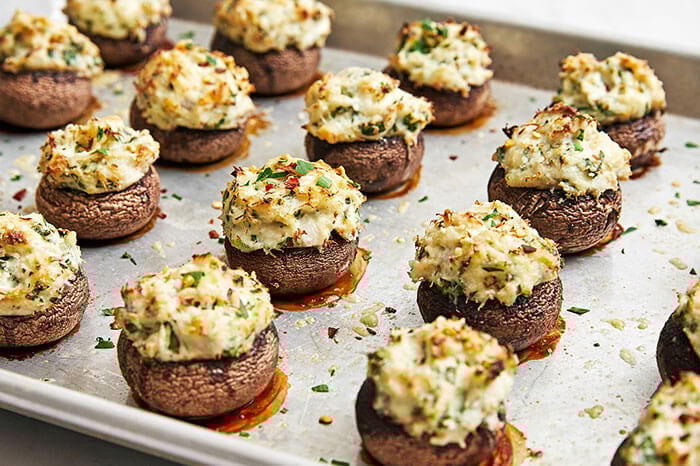 A sheet pan of crab stuffed mushrooms