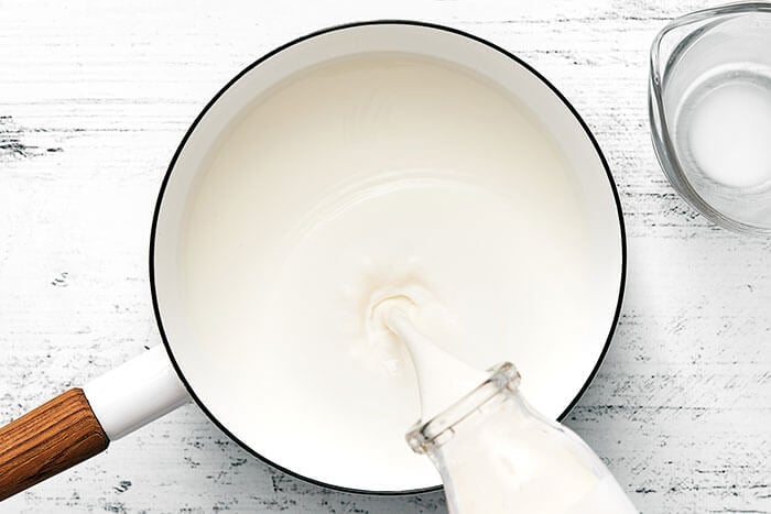 Warmed up cream in a pot