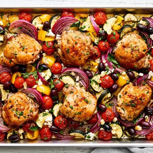 A sheet pan of Greek chicken and vegetables.
