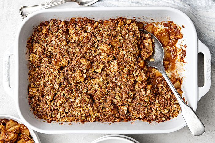 A casserole dish with apple crisp.