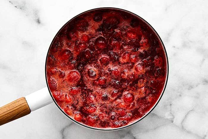 Boiled cranberry sauce in a pot.