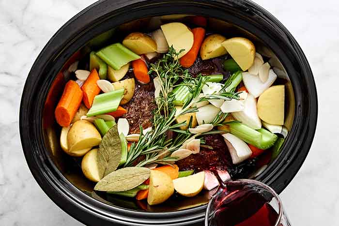 Preparing pot roast in slow cooker.