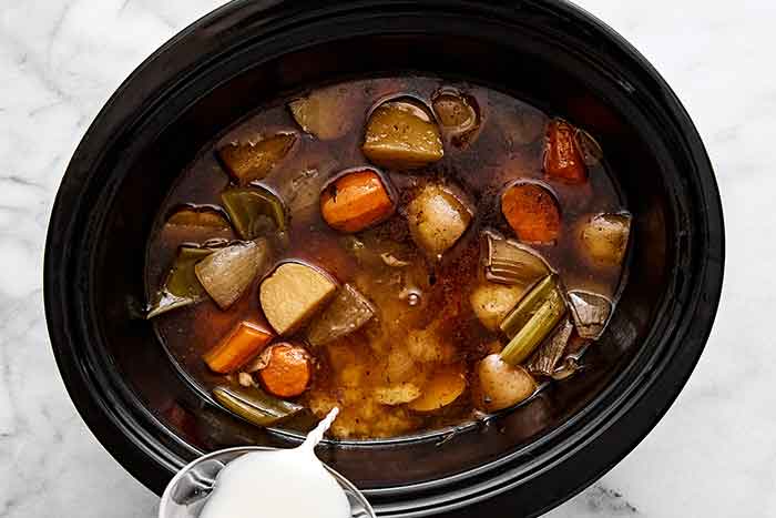 Adding slurry into pot roast.