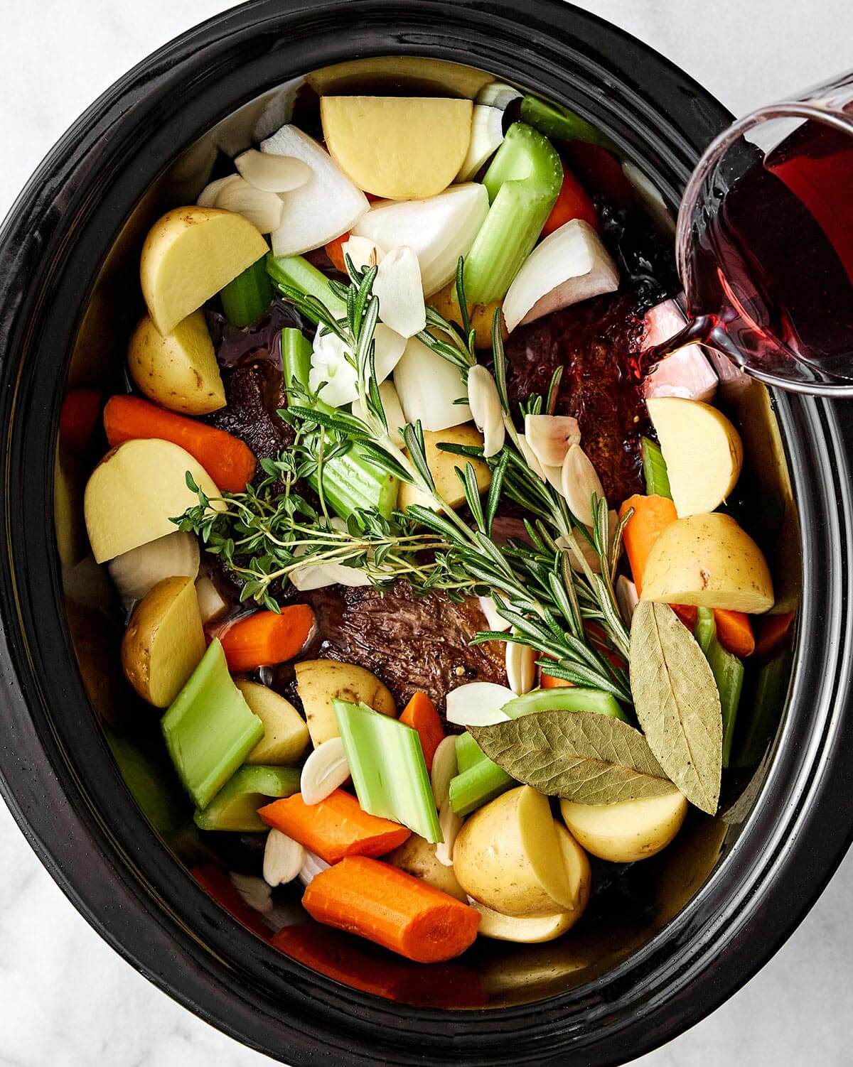 Prepping slow cooker pot roast.