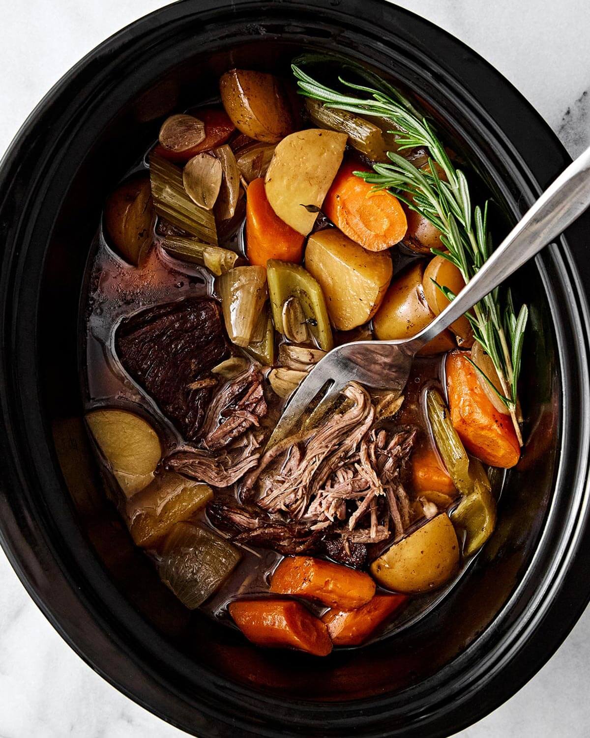 Pot roast in a slow cooker.