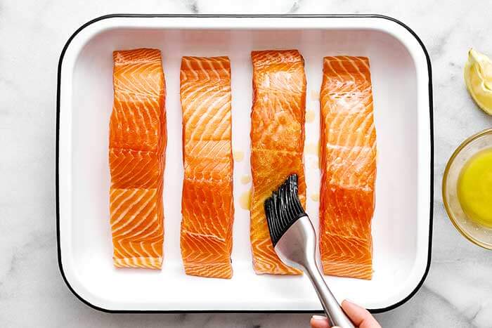 Salmon fillets with butter on top.