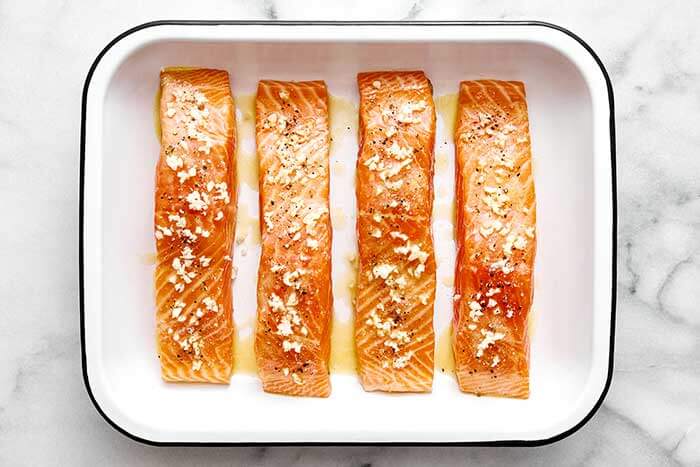 Salmon fillets with garlic butter sauce.