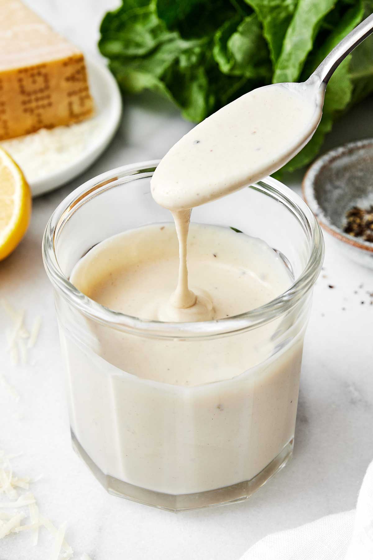 Caesar dressing in a cup.