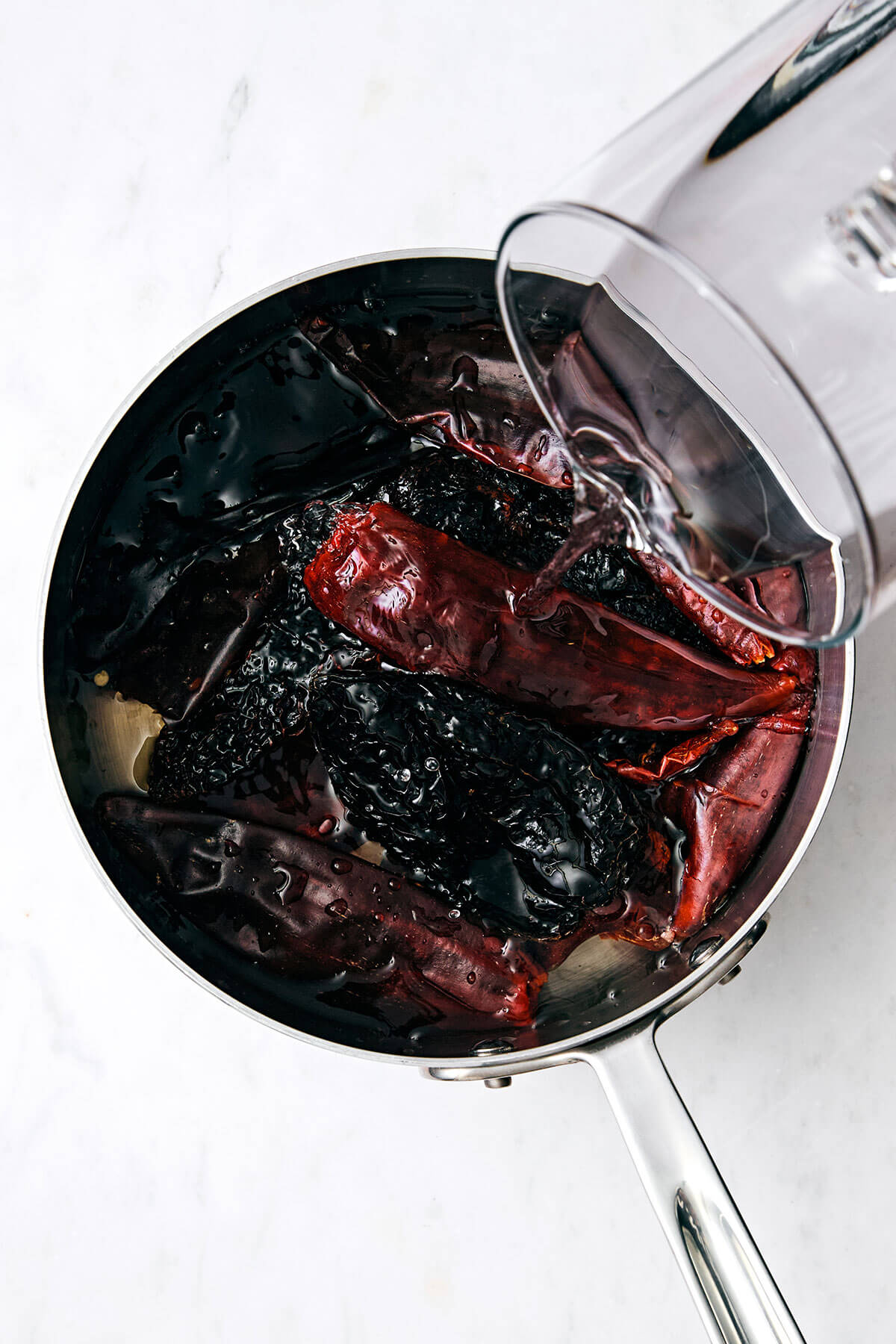 Boiling Mexican chiles in a pot.