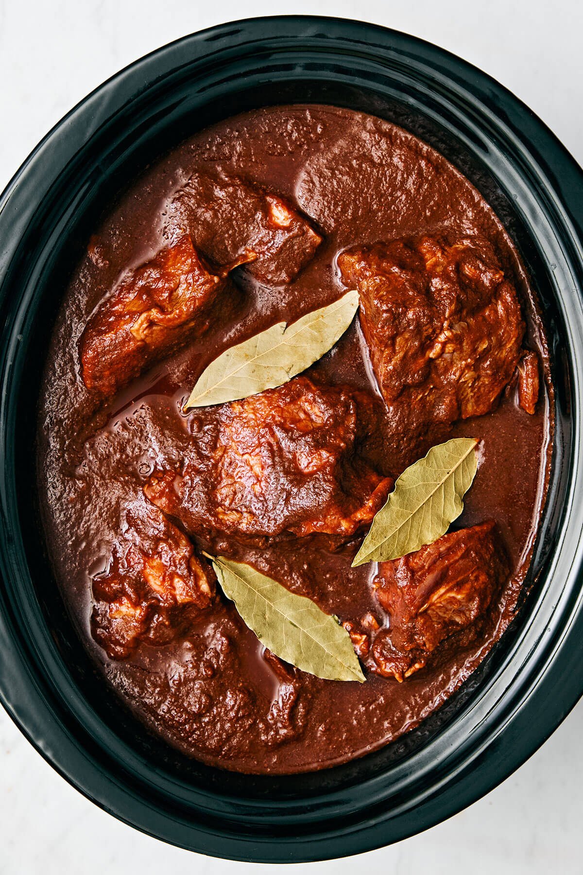 Birria de res in a crockpot.