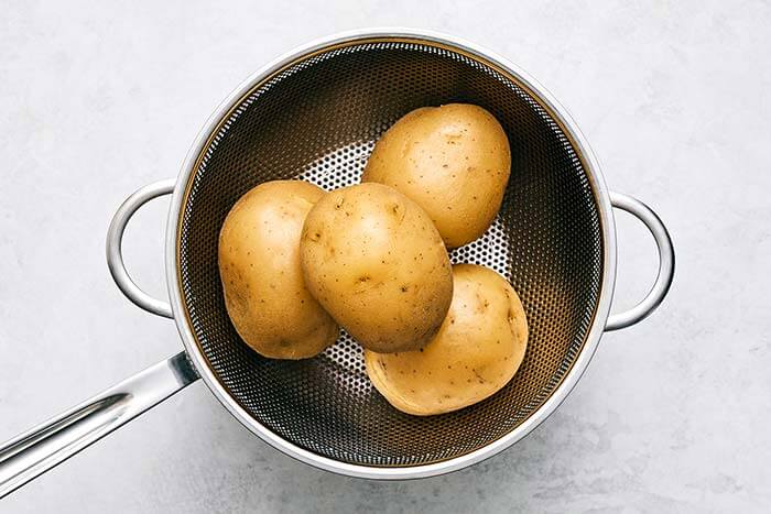 Drained potatoes in a colander.