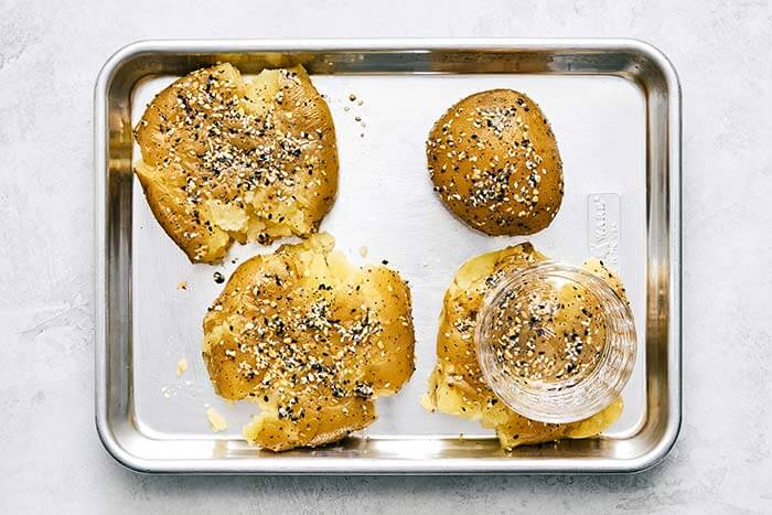 A sheet pan of smashed potatoes.