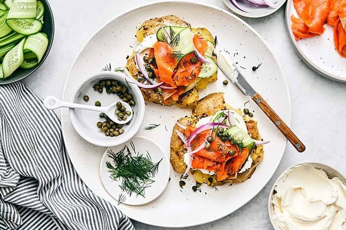 A plate of smashed potatoes everything bagel.
