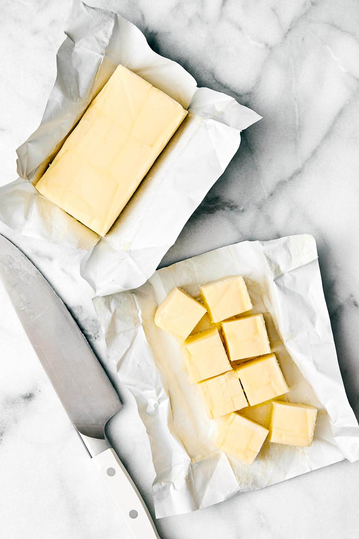 Sliced butter on a table.
