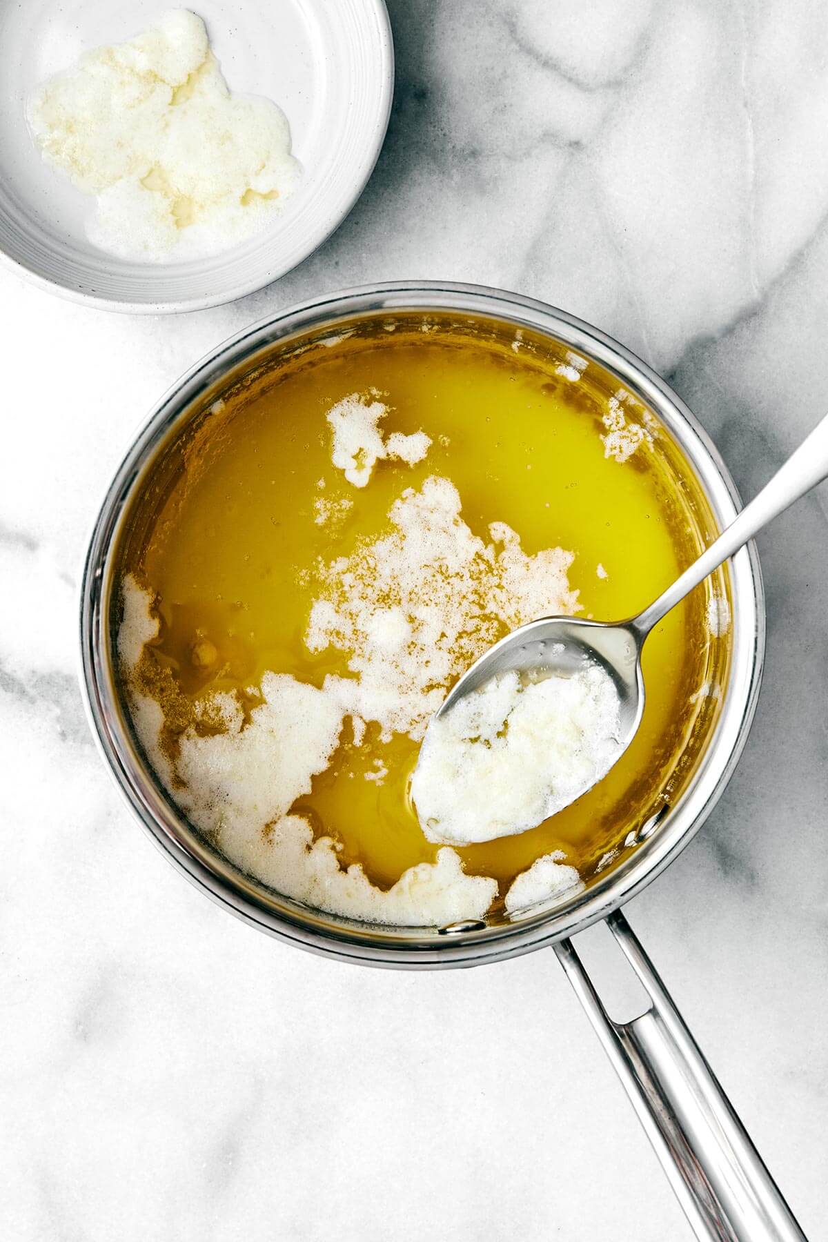 Boiling butter in a pot.
