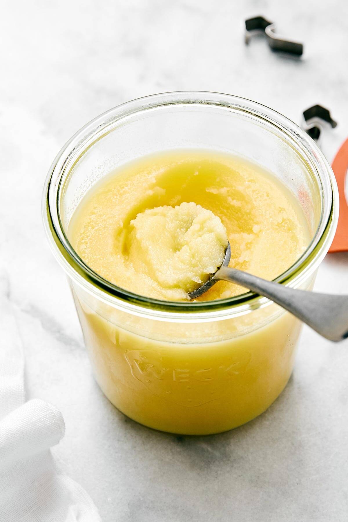Ghee in a glass jar.