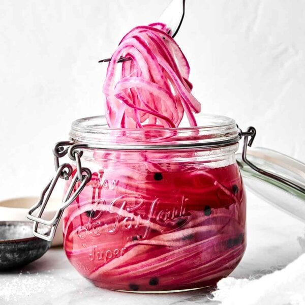 A jar of quick pickled red onions.