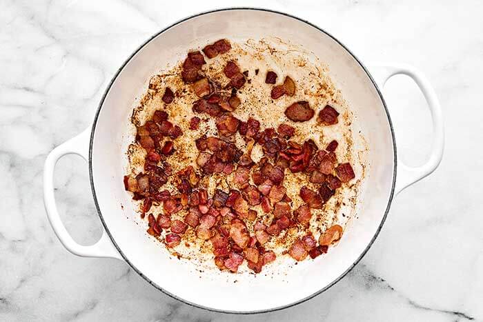 Cooked bacon in a pot.