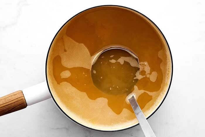 Vegetable broth in a pot.