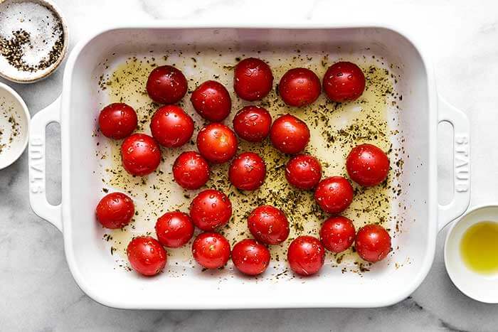 Baking dish with cherry tomatoes.