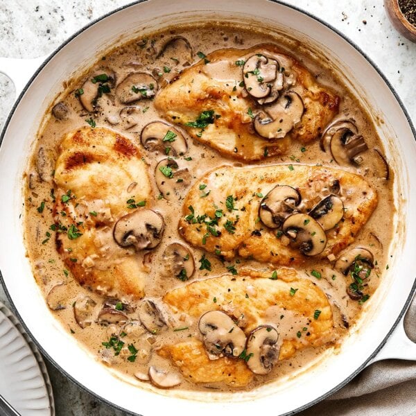 A white pan with chicken Marsala.