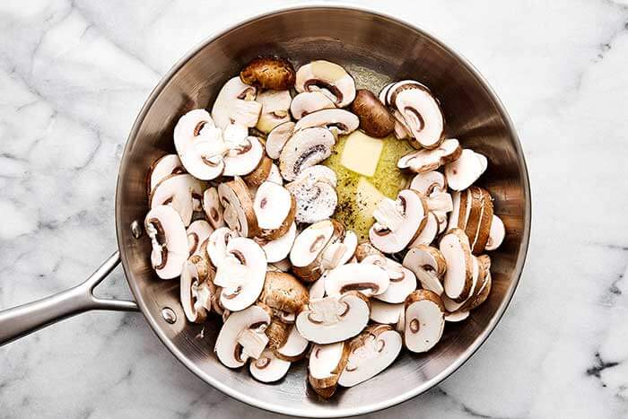 A pan with sauteed mushrooms.