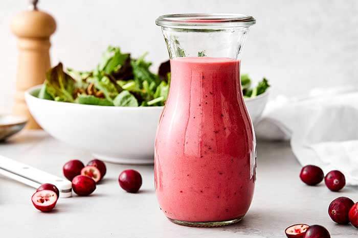A glass bottle of cranberry vinaigrette.