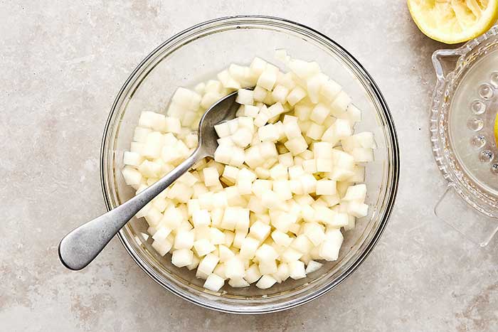 A bowl of chopped pears.