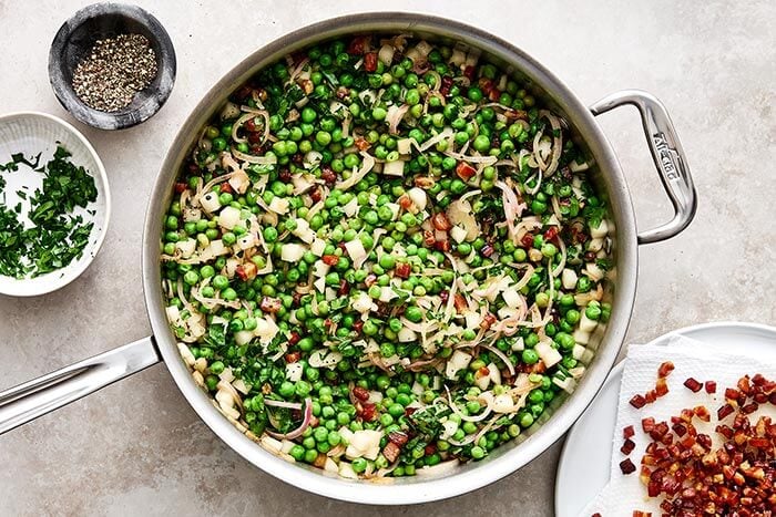 A pan with Thanksgiving peas side dish.