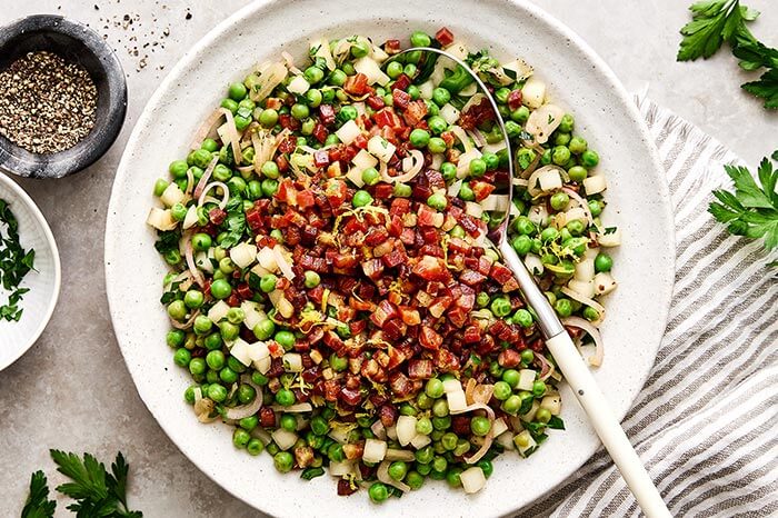 A bowl of Thanksgiving peas with pancetta.