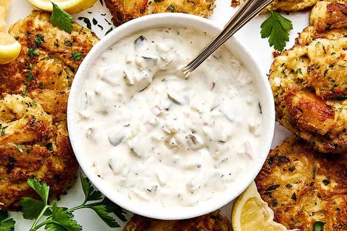 Tartar sauce with crab cakes.