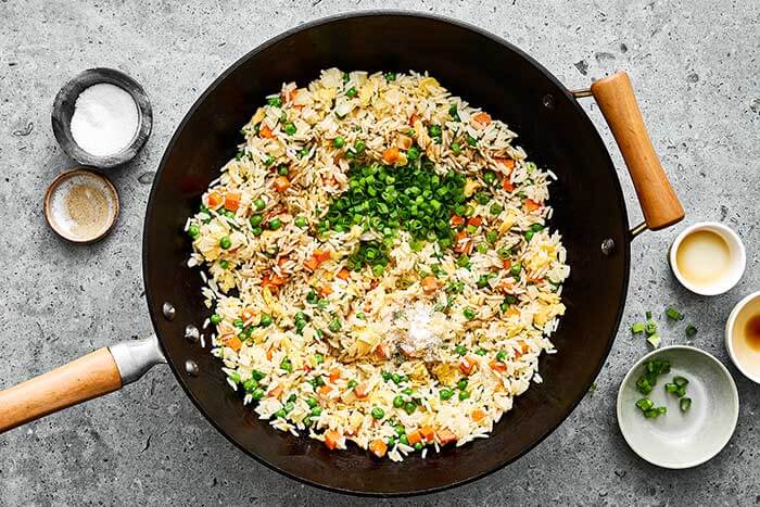 Cooking fried rice in a pan.