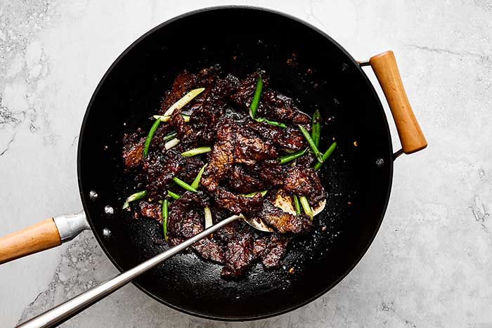 Mongolian beef in a wok.