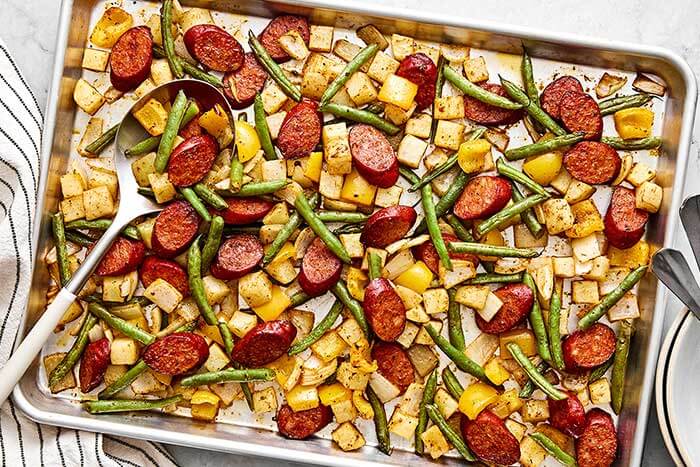 Cajun sheet pan sausage and vegetables recipe.